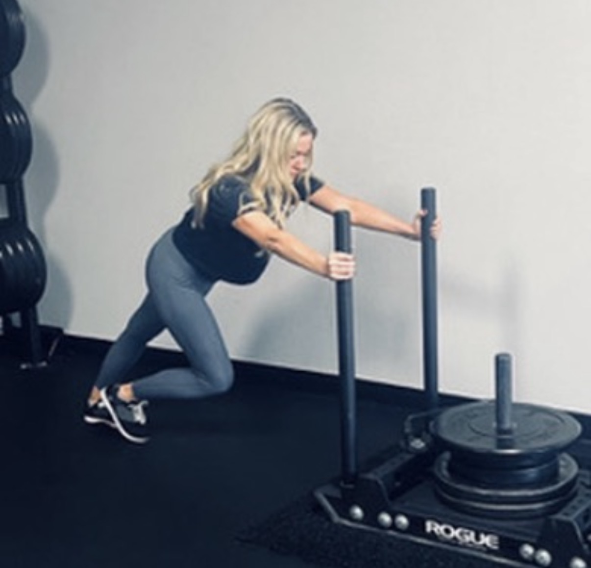 Shauna pushing weighted sled